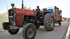 Ghassan, 10-year-old child working for his father as a tractor driver