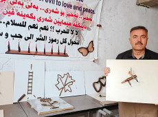 Hussein turns bullet casings into paintings calling for peace