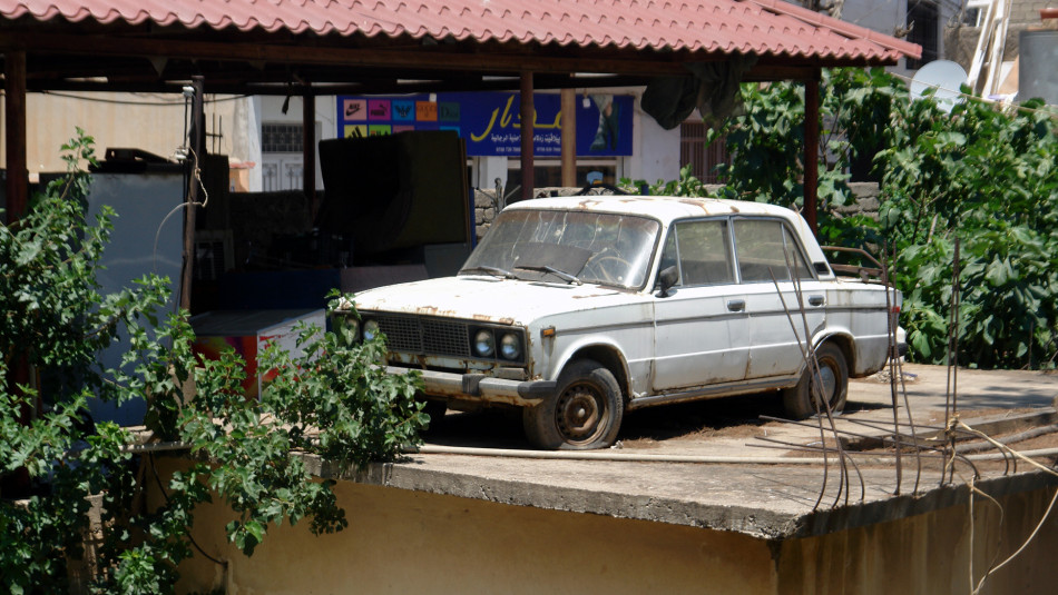 Why Russian-made car laid on rooftop in Duhok?