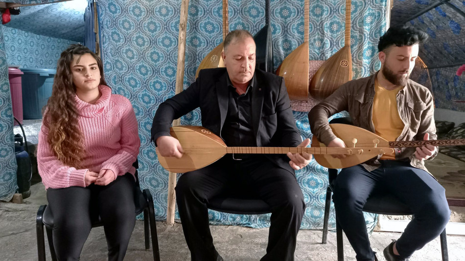 A family music band in an IDP camp