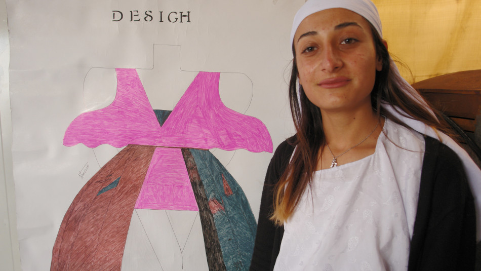 Narvin, a displaced 17 years old girl makes money from cloth designing in a camp