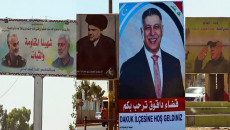 Daquq district dotted with pictures of political and military figures