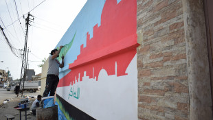Two young fine arts graduates in Mosul use colour and painting to add life to the war-shattered city.